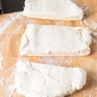 The biscuit dough cut into three pieces