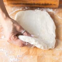 The biscuit dough is rolled to a half inch thick