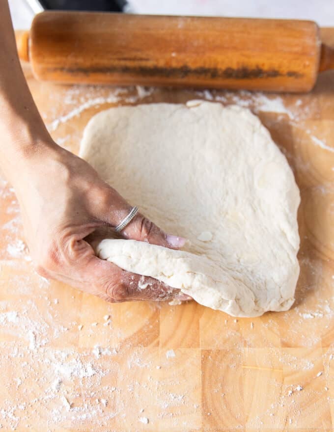 The biscuit dough is rolled to a half inch thick
