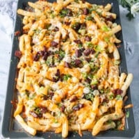 the toppings are added over the melted cheese