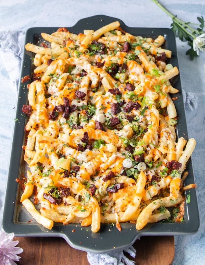 the toppings are added over the melted cheese