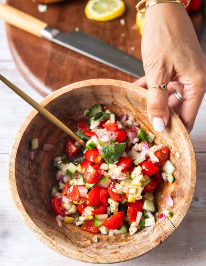 The topping ingredients all mixed together in a bowl and ready to use on the sandwich