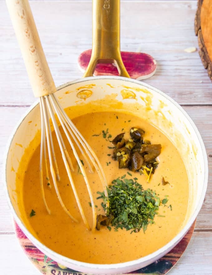 roasted poblanos and cilantro are now added to the queso