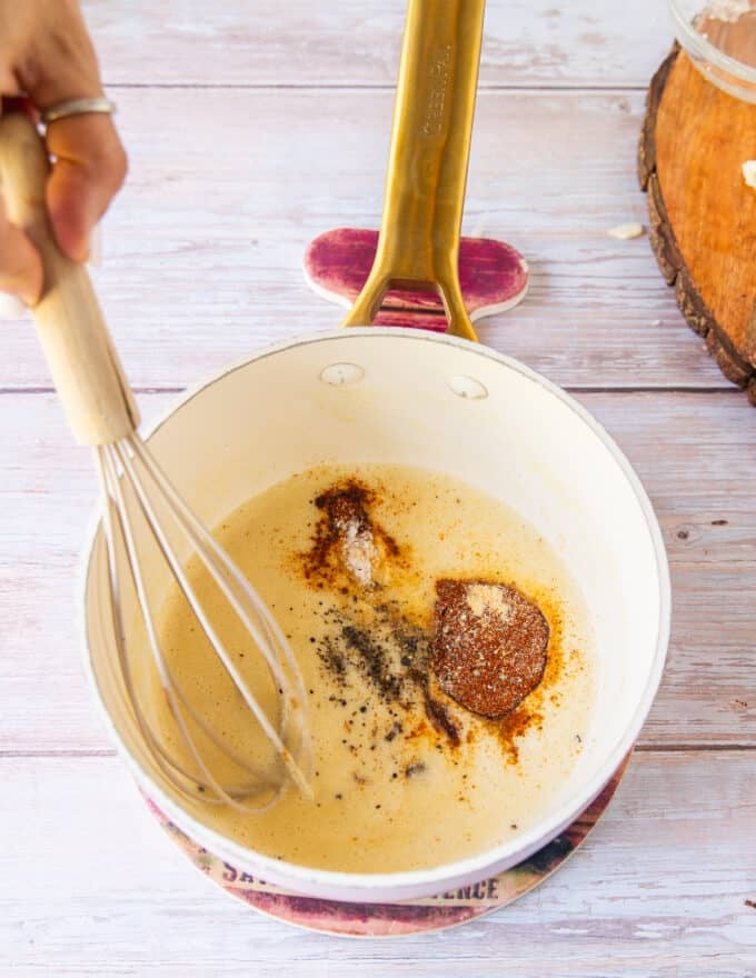 Add the spices to the pan to infuse the base 