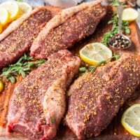 Picanha steaks seasoned on both sides with coarse salt, pepper and some steak seasoning