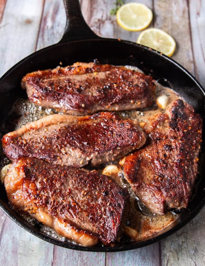 golden crust on the flipped steak continue to cook