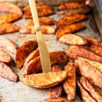 flipped potato wedges on both sides showing the ultimate crips texture on the outside and golden color with fluffy inside