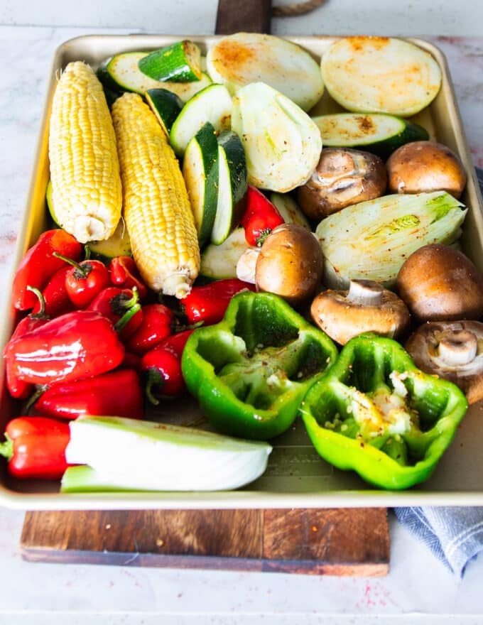 veggies all cut up and ready on a large tray
