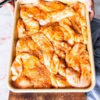 Chicken pieces are now coated in the spice blend and olive oil