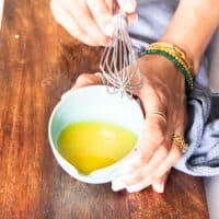 Make the salad dressing by whisking all ingredients in a small bowl