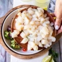 Fresh scallops diced on a plate or sliced