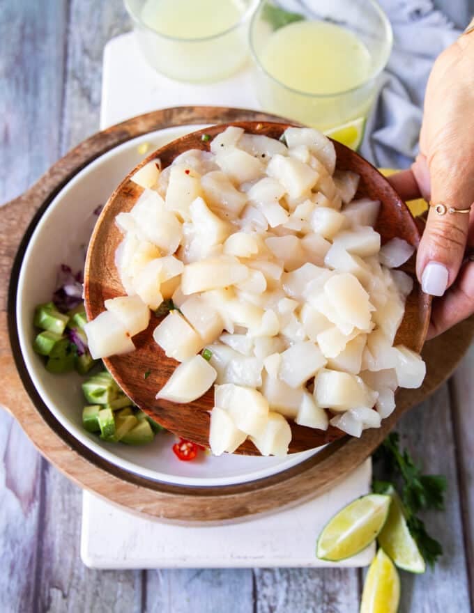 Fresh scallops diced on a plate or sliced