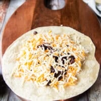 A generous layer of cheese is added now