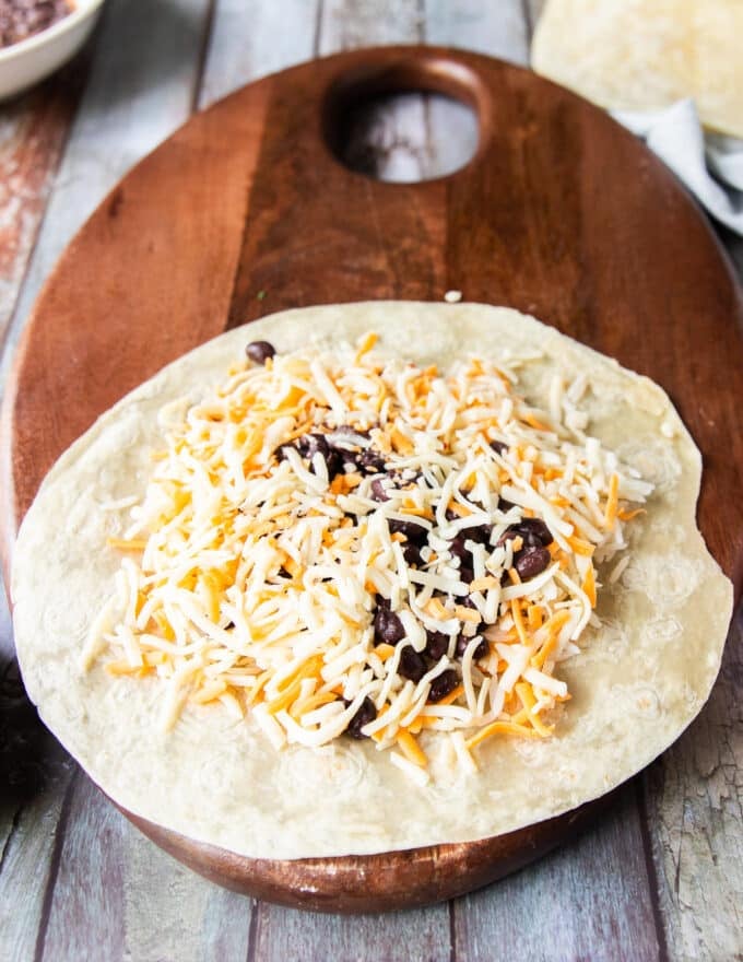 A generous layer of cheese is added now