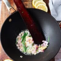 Shallots and garlic sautéed in a large skillet