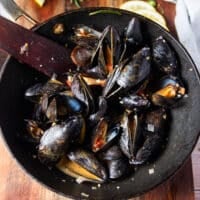 the mussels have opened up and released their juices into the pan to make the sauce