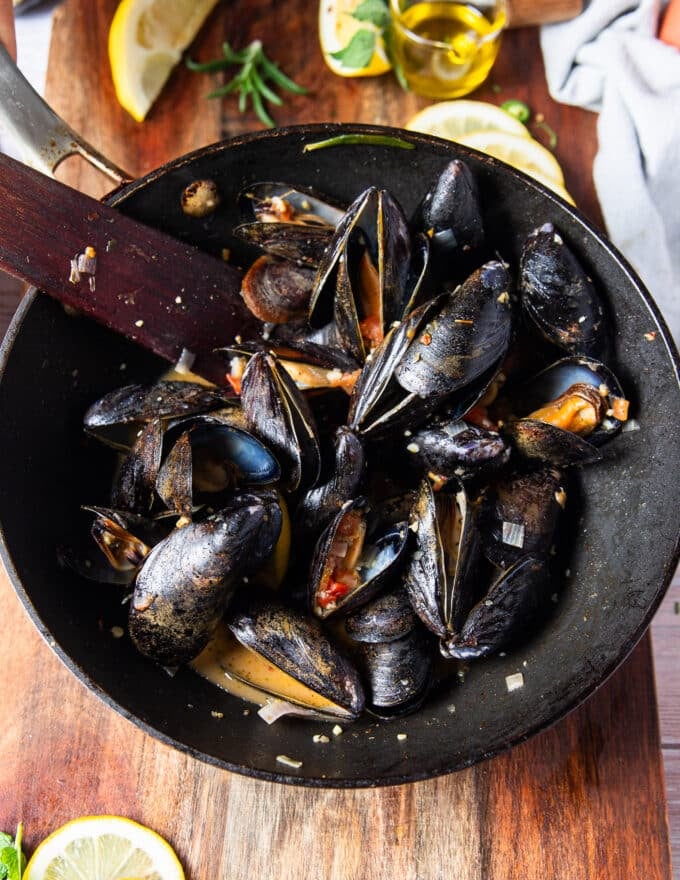 the mussels have opened up and released their juices into the pan to make the sauce