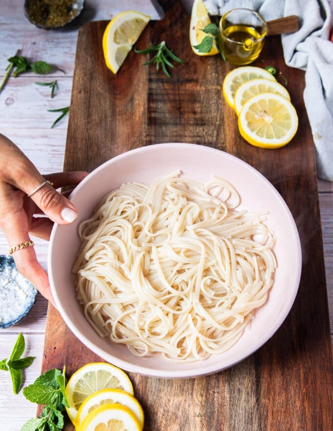 the cooked pasta is added to a bowl